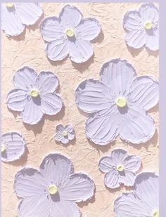 some white flowers on a pink and purple background