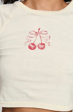 Tasty cherries topped with a bow center a snug-fitting baby tee perfect with your high-waist looks. Crewneck Short sleeves 100% cotton Machine wash, tumble dry Imported Graphic Baby Tee, Cropped Graphic Tees, Baby Graphic Tees, Pink Formal Dresses, Fleece Dress, Sweatshirt Set, Outerwear Outfit, Strapless Tops, Loungewear Sets