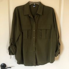 Old Navy Olive Green Blouse. Size Large. Boxy Style. Nwot. Button Up Front Two Breast Pockets Role Up Sleeves With Attaching Button. Khaki Button-up Office Tops, Khaki Button-up Tops For Office, Khaki Office Tops With Button Closure, Khaki Button-up Workwear Blouse, Khaki Button-up Blouse For Work, Olive Button-up Workwear Shirt, Olive Button-up Shirt For Work, Oversized Khaki Tops With Buttons, Olive Tops With Button Closure For Work