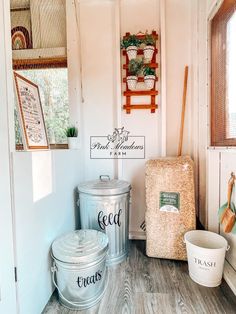 two buckets are sitting next to each other on the floor in front of a door