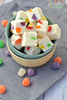 a bowl filled with white and multi colored candy