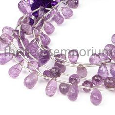 amethorate necklace with purple glass beads and silver wire, set on a white background