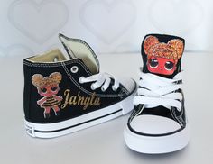 pair of black and white shoes with cartoon characters on them