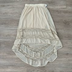 Nwt. Elastic Waist. Color Is A Light Tan. Summer Beige Lace Maxi Skirt, Flowy Lace Maxi Skirt For Beach, Summer Beige Skirt With Lace Trim, Sheer Beige Bottoms For Spring, Summer Lace Lined Maxi Skirt, Lace Lined Summer Maxi Skirt, Spring Beach Maxi Skirt With Lace Trim, Sheer Beige Bottoms For Summer, Chic Lace Trim Maxi Skirt For Summer