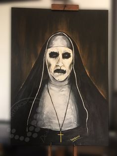 a painting of a nun holding a cross on it's chest and wearing a white mask