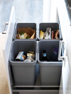 three bins with food and drinks in them