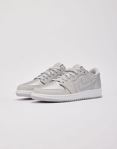 This new take on the Air Jordan 1 Retro Low OG is inspired by the Japan-exclusive CO.JP Air Jordan 1 Retro High OG of the same name. It features a "Neutral Grey" leather upper with shimmering "Metallic Silver" hits. Jewel Wings-logo emblems on the heel tie the ensemble together. Leather upper Leather overlays Swoosh ov Graphic Tee Outfits, Wings Logo, Jordan Air, Air Jordan 1 Retro High Og, Air Jordan 1 Retro High, Kids Jordans, Boy Shoes, Air Jordan 1 Retro, Fall Shoes