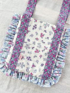 a purse with ruffles and flowers on it