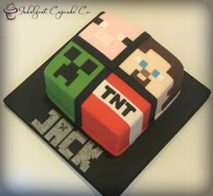 a cake made to look like an old video game console with the words nnt on it