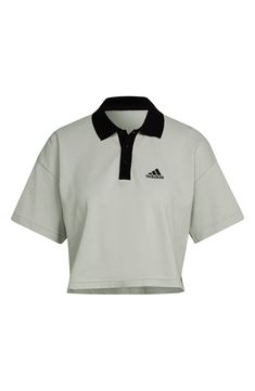 An abbreviated hem adds a fresh take on this classic polo-inspired T-shirt that brings collegiate vibes to any ensemble. Spread collar Short sleeves 70% cotton, 30% recycled polyester Machine wash, tumble dry Imported Sporty Polo Collar T-shirt With Relaxed Fit, Sporty Collared T-shirt For College, Sporty Polo Collar Top For Streetwear, Cotton Polo Collar T-shirt For College, Sporty Relaxed Fit Polo Collar T-shirt, Sporty Green Polo Collar T-shirt, Sporty Cotton Polo Shirt For College, Adidas Cotton Sportswear Tops, Adidas Casual Short Sleeve Polo Shirt