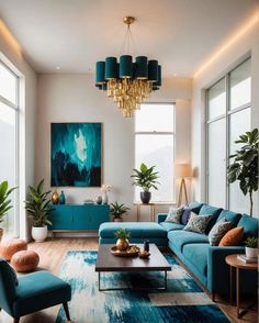 a living room filled with blue couches next to tall windows and potted plants