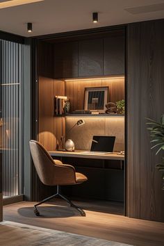 an office area with a desk, chair and laptop on the table in front of glass doors