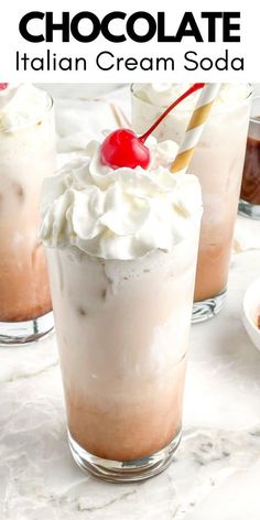 chocolate italian cream soda with whipped cream and cherries in glasses on a marble table