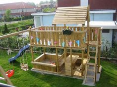 a wooden play set in the yard