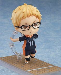 a figurine with glasses on top of a board