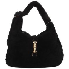 Gucci Jackie 1961 Black Fluffy Shearling Bag Small These are professional photos of the actual bag. The Gucci Jackie 1961 Black Small bag is a modern take on an iconic design. Crafted in black fluffy shearling and lined with fabric, this "Teddy-like" rare super cute Jackie is your perfect accessory. CONDITION: EXCELLENT Scratches to the hardware DETAILS: Brand: Gucci Model: Jackie 1961 Exterior Material: Shearling Exterior Color: Black Interior Material: Fabric Interior Color: Black Hardware Color: Gold Size: Small Dimensions: Width: 28cm, Height: 18.5cm ACCESSORY: shoulder strap, dust bag, info booklet Gucci Models, Black Hardware, Professional Photo, Black Interior, Exterior Colors, Small Bag, Fashion Handbags, Small Bags, Colorful Interiors