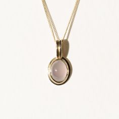 Less is more with this understated stunner. The pendant is made in 18k gold and comes on an 18” curb chain made in solid 14k gold. The chalcedony is made with a Nevada-mined chalcedony. It has a beautiful opaque lilac hue that really radiates against the yellow gold bezel. Fine Jewelry In Yellow Gold With Chalcedony, Formal Yellow Gold Chalcedony Jewelry, Minimalist Yellow Gold Cabochon Jewelry, Minimalist 14k Gold Jewelry With Cabochon, Chalcedony Cabochon Yellow Gold Jewelry, Everyday 14k Gold Oval Cabochon Jewelry, Yellow Gold Chalcedony Jewelry With Cabochon, Everyday 14k Gold Jewelry With Oval Cabochon, Modern Chalcedony Jewelry With Polished Finish