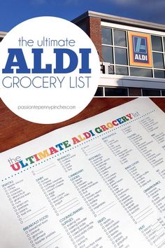 the ultimate aldi grocery list is displayed in front of a building with an advertise