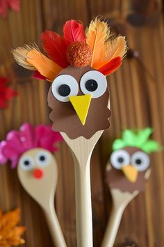 three wooden spoons with fake turkey heads on them