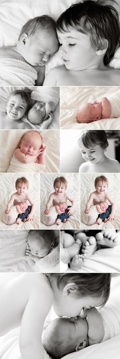 a woman holding a baby in her arms while laying on top of a white bed