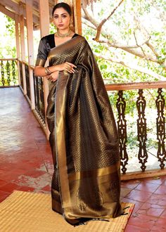 ROYAL PRINCESS GOLDEN BLACK WOVEN KANJIVARAM 145006D  Desc:      Elegancy and Simplicity of  this Kanjivaram saree easily attract eyes. With exquisite design spread across the length of the saree it is perfect for any occasion.Saree length : 5.5 meterBlouse piece :  0.8 meterFabric : Blended silk. With Express Free Shipping and Custom Stitching, Buy Indian Party wedding wear Kanchipuram Silk Saree ROYAL PRINCESS GOLDEN BLACK WOVEN KANJIVARAM 145006D online in USA, UK and Canada from KollyBollyEt Black Kanjivaram Saree, Black Cotton Saree, Royal Blue Saree, Golden Saree, Kanjivaram Saree, Saree Floral, Purple Saree, Raw Silk Saree, Kanjivaram Silk Saree