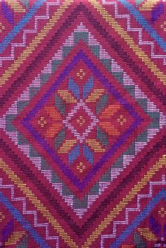 a close up view of a colorful cushion