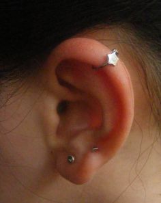 an ear with two silver stars on it