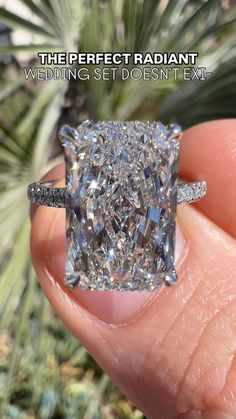 a person holding a diamond ring with the words, the perfect radiant wedding set doesn't exit