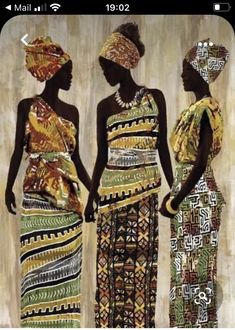 three women in african print dresses standing next to each other