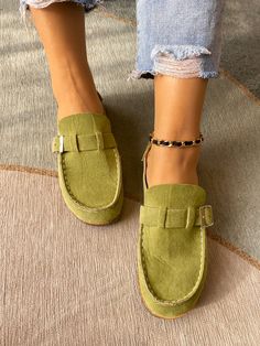 A stunning strap decorates the top of this mule to provide a sleek accent to your on-the-go ensemble. PU upper Man Made lining Cork footbed Man-made sole Green Flat Heel Slip-ons For Spring, Green Leather Loafers For Summer, Casual Flat Loafers With Buckle Closure, Casual Loafers With Buckle Closure And Flat Heel, Casual Loafers With Buckle Closure, Green Closed Toe Slip-ons For Spring, Chic Slip-on Flats With Buckle Closure, Trendy Flat Heel Mules, Casual Mules With Buckle Closure And Round Toe