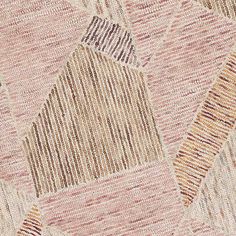 a close up view of an area rug with different colors and patterns on the surface