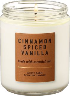 a white candle with cinnamon spiced vanilla inside