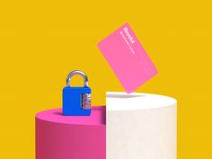 a pink and white container with a blue padlock on it next to a yellow background