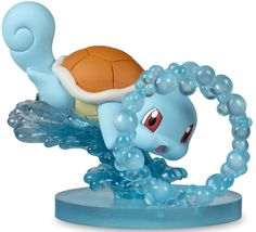 a small toy turtle riding on top of a blue object with bubbles around it's neck