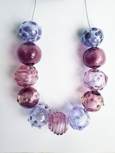 a necklace made out of different colored glass beads