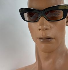 Vintage 1960'S Sci Fi Sunglasses in a sixties futuristic style, very thick cyber sci fi Frames.. these are Unisex, so both guys and gals can wear them.... These frames are so fun & funky! Kinda Mod, kinda Sci Fi... on the stem is printed: MADE IN FRANCE These were made as fashion sunglasses in the 1960's from France.. and are Used but in EXCELLENT VINTAGE CONDITION. There is gold coloring along the front of the frames, stronger color on the right side where the left side seems rather faded. Retro Sunglasses With Gradient Lenses For Evening, Retro Evening Sunglasses With Gradient Lenses, Retro Cat Eye Sunglasses With Mirrored Lenses For Party, Retro Anti-reflective Cat Eye Sunglasses, Retro Cat Eye Sunglasses For Parties, Retro Black Sunglasses For Evening, Retro Cat Eye Sunglasses For Evening, Retro Cat Eye Sunglasses For Party, Retro Black Sunglasses For Formal Occasions