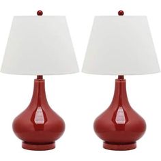 two red lamps sitting next to each other on top of a white table lamp shade