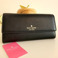 Southport Avenue In Black Pebbled Leather Travel Wallets In Black Textured Leather, Black Textured Leather Travel Wallet, Classic Kate Spade Wallets For Daily Use, Kate Spade Black Rectangular Wallet, Kate Spade Black Leather Wallet, Black Leather Kate Spade Wallets, Kate Spade Black Bag With Card Slots, Kate Spade Leather Wallets For Everyday Use, Kate Spade Everyday Bifold Bag