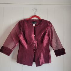 This is a vintage, Alex Petite Evenings, burgundy, evening or formal, jacket or blazer, with sheer, 3/4 sleeves and rhinestone buttons. This has shoulder pads. It is a size small petite. Pease refer to the measurements below for a proper fit. All sales are final.  The measurements are as follows: (all measurements taken flat)   Shoulder to shoulder: 15.25 inches  Armpits: 19 inches Waist: 15.25 inches  Sleeve Length from shoulder: 17.25 inches Length: 21.5  inches (from back of the neck)  If you have a wish list or are looking for something specific, please ask. I may have exactly what you are looking for.  As always please convo me with any questions or concerns regarding this item or with any international shipping questions. Unfortunately I do not accept returns or grant refunds. All sh Classic Formal Outerwear With 3/4 Sleeves, Elegant Burgundy Outerwear For Party, Elegant Burgundy Party Outerwear, Elegant Long Sleeve Burgundy Blazer, Elegant Burgundy Blazer For Party, Elegant Burgundy Party Blazer, Elegant 3/4 Sleeve Blazer For Formal Occasions, Burgundy Fitted Outerwear For Semi-formal Occasions, Burgundy Long Sleeve Blazer For Formal Occasions