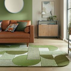 a living room filled with furniture and green walls