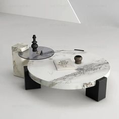 a marble coffee table with black legs