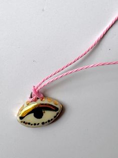 This charm is handmade in stoneware, hand painted and finished with premium quality gold. Set on waxed thread the color of your choice and its size it's adjustable lenghth to fit as a choker to a 20" drop necklace Each piece is handmade one by one and therefore yours might look slightly different that the one picture above. Clay Pendants, Puzzle Crafts, Class Gift, One Picture, Gifts Cards, Jewelry Inspo, Drop Necklace, Gold Set, How To Make Wreaths