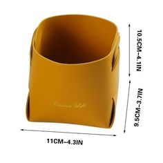 an image of a yellow leather vase on a white background with measurements for the size