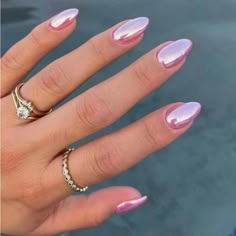 a woman's hand with pink and white manicured nails