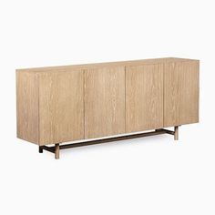 the sideboard with three doors and two drawers on one end, in light wood