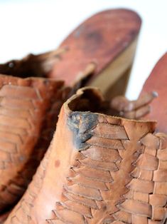 "This is a pair of vintage Shoes n Stuff by Frank Sbicca platforms. Beautifully aged, basket weave brown leather shapes the top of the mules. They have a bold wood platform heel with a cut-out design. An aged metal \"Stuff\" brand logo emblazons the right platform. CONDITION In good condition with wear consistent with age and use. There is a dark spot in the leather of the left shoe. Original insole label is missing. Verdigris on the side metal brand logo. MARKED SIZE: 9 FITS LIKE: 7.5 / 8 MEASU Retro Leather Platform Mules, Brown Woven Sole Mules With Round Toe, Retro Leather Open Toe Mules, Brown Mules With Woven Sole And Round Toe, Brown Round Toe Mules With Woven Sole, Vintage High Heel Platform Clogs, Vintage High Heel Clogs With Leather Sole, Vintage Clogs With Stacked Heel, Open Toe, Vintage Open Toe Clogs With Stacked Heel