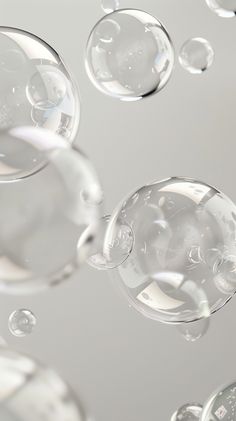 bubbles floating in the air on a gray background