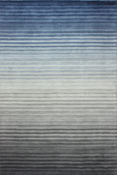 a rug with blue and grey stripes on it