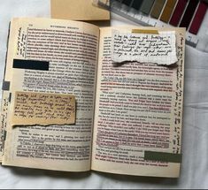 an open book with some writing on it next to a ruler and color swatches