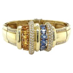 Simply Beautiful! Finely detailed Blue and Yellow Sapphire Diamond Vintage Gold hinged Clamper Bracelet. Securely Hand set with Blue and Yellow Sapphires, weighing approx. 8.50tcw and Diamonds, approx. 2.25tcw. Measuring approx. 7”. More Beautiful in Real time! Sure to be admired…A piece you’ll turn to time and again! Vintage Gold Bracelet, Gold Armband, Yellow Sapphire, Vintage Bracelets, Vintage Diamond, Sapphire Diamond, Simply Beautiful, Estate Jewelry, Vintage Gold